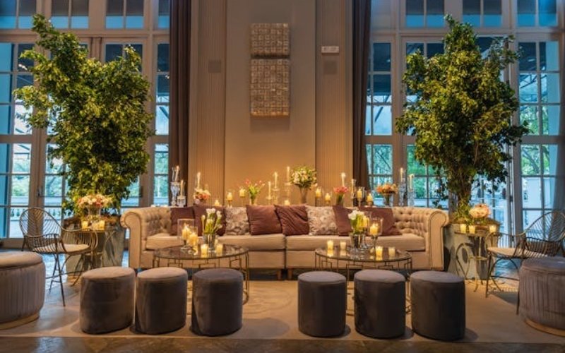 Restaurant Sofa Surrounded by Ottoman Stools